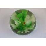 Glass Paperweight with green & white flower design inside, approx 6cm diameter