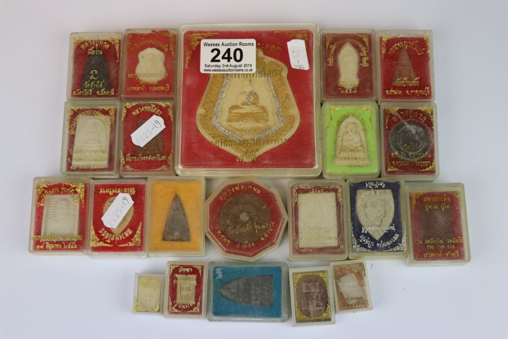 21 Boxed Thai Buddhist Amulets to include a large example