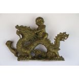 Bronze model of a Boy on Dragon which is holding a Flaming Pearl, stands approx 8.5cm