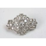 Art Deco diamond and unmarked platinum stepped brooch, comprising thirty-three graduated round