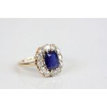 Sapphire and diamond oval cluster yellow gold ring, the central cushion cut blue sapphire possibly a