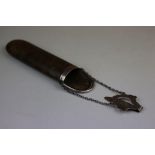 Silver mounted leather glasses case suspended from silver belt hook attachment with engraved foliate