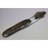 Late Victorian silver and leather glasses case with hinged lid, the pierced silver case depicting