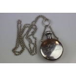 Silver scent bottle of circular form, suspended from silver belcher link chain, engraved initials