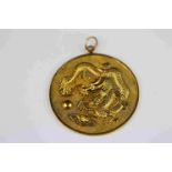 14ct yellow gold Chinese medallion, three toed dragon chasing ball, in relief, textured ground,