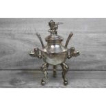 Chinese silver plated twin handled censer raised on three bun feet with mask decoration to the legs,