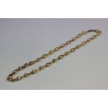 9ct yellow gold necklace comprising ribbed oval beads and smooth spherical beads with links between,