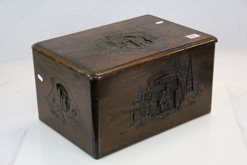 Carved Oriental Hardwood Sewing box with figural scene to lid, measures approx 44 x 31 x 24cm