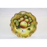 Colaport Gilded plate with hand painted image of Fruit, signed "M Pinter", approx 23cm diameter
