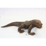 Carved wooden model of a monitor type lizard