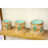 Three graduating 19th Century Majolica ceramic planters with stands, all having a Bamboo design, the