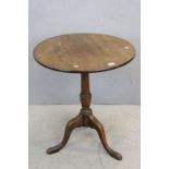 Georgian Oak Circular Tilt Top Table on turned pedestal support and three splayed legs, 66cms