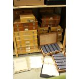 A large collection of 35mm slides contained within a quantity wooden storage cases.