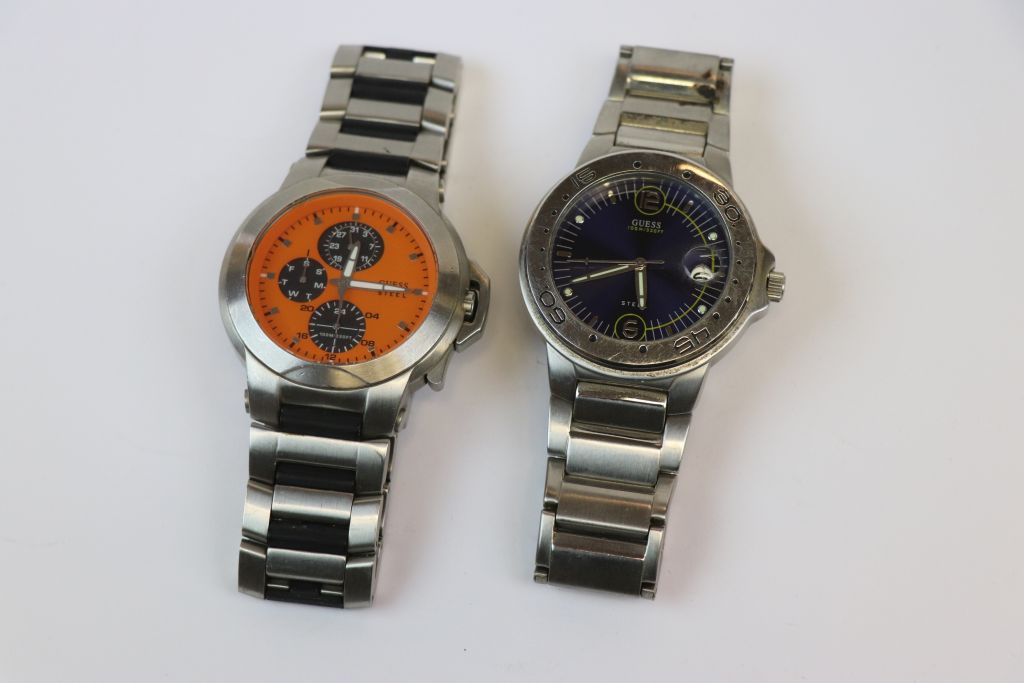 Two Gents Stainless Steel Quartz Gents wristwatches by "Guess", one with orange dial