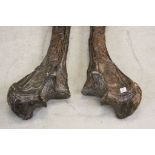 Vintage pair of ornately carved African animal Leg bones depicting Tribal scenes and each approx