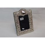 A hallmarked silver easel back photograph frame.