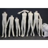 A collection of seven shop mannequins to include a bag of arms and heads.