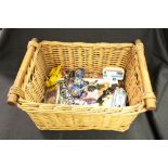 Wicker basket of collectables to include Diecast vehicles, Star Wars Top Trumps, Triumph car