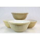 Four vintage glazed Stoneware mixing Bowls to include one marked to base "Mason Cash", approx 31cm