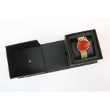 Boxed Gents Larsson & Jennings wristwatch, with red metallic dial 7 gold finish stainless Steel case