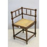 Early 20th century Oak Corner Chair with Bobbin Supports and Rush Seat