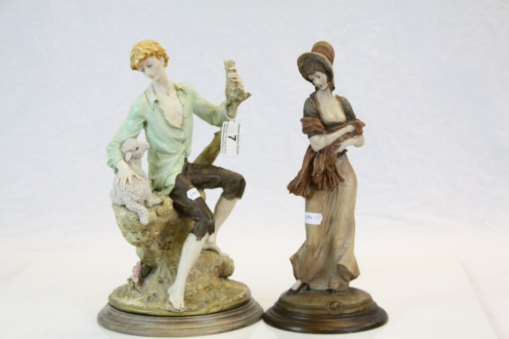 Two painted figurines with Wooden bases to include a Female with shawl & a Man with a Lamb