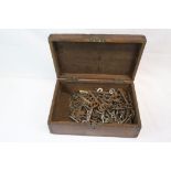 Wooden box containing a quantity of antique and vintage keys