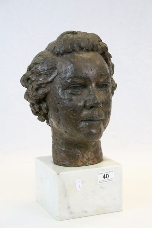 Cold cast bust of a females head on a marble base, stands approx. 39cm