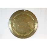 Large Middle Eastern Brass circular Tray or table top, approx 88cm diameter with engraved Floral