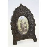 Heavily carved Oak picture frame with foliage decoration, easel style, stands approx. 27.5 cm with