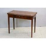 Early 19th century Mahogany Fold Over Tea Table with Small Drawer and raised on square tapering