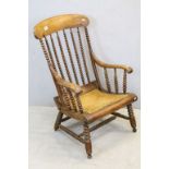 19th century Lathe Back Elbow Chair with Bobbin Supports and Cane Seat