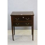 Early 20th century Mahogany Side Table with Two Drawers raised on square tapering legs with castors,