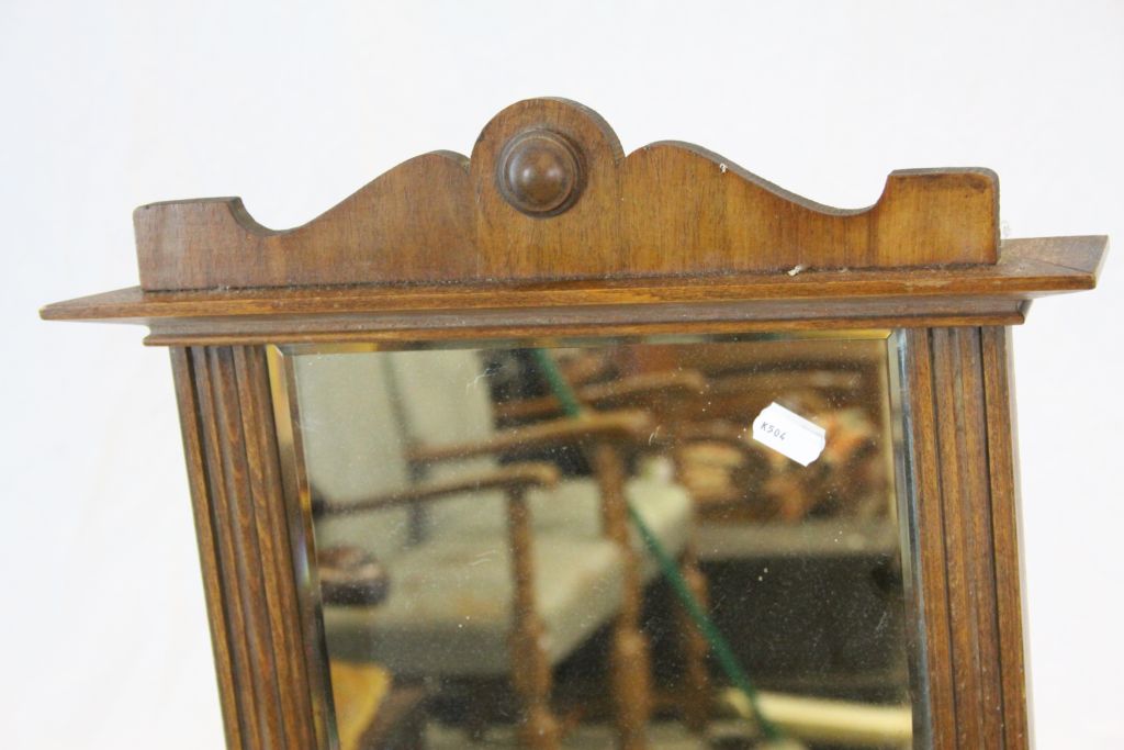 Oak framed bevelled glass wall Mirror, set with key wind German Alarm clock & Bell, measures - Image 3 of 5