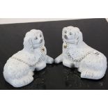 Pair of Staffordshire style recumbent Dogs with Gilt finished neck chains, each approx 20cm long