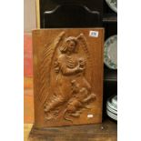 Oak Carved Panel depicting St Michael killing a Beast marked to verso P H Etheredge, 45cms x 32cms