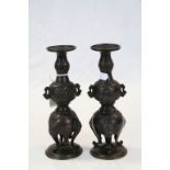 Pair of vintage Oriental Bronze Candlesticks, with tripod feet and on Brass stands, each approx 20cm