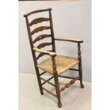 19th century Provincial North Country Macclesfield Ladder Back Elbow Chair with Rush Seat