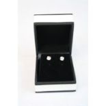 Pair of White Gold diamond stud earrings of 80 points approx.