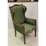 Edwardian Mahogany and Boxwood Inlaid Upholstered Wingback Chair raised on square tapering legs