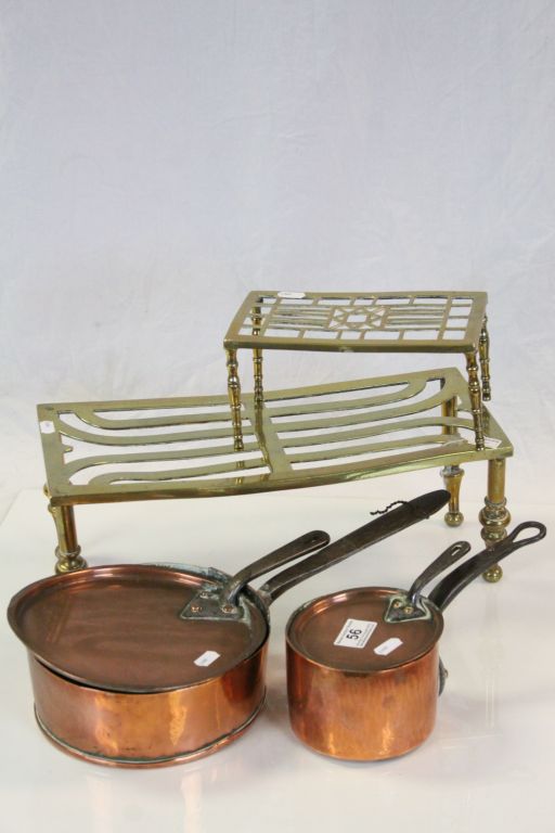 Two Brass Trivets & two Copper Saucepans with lids, both with steel handles