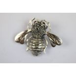 Silver bug brooch with ruby eyes