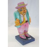 South American Carved Wooden Brightly Painted Figure of a Bird dressed in a Suit, 54cms high