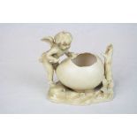 German Ceramic posy Vase with Cherub & Egg, marked to base for "Rudolstadt" and standing approx