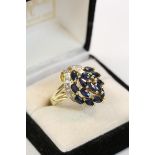 Sapphire and diamond 14ct yellow gold ring, comprising fourteen marquise cut blue sapphire in