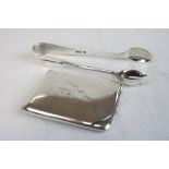 Silver matchbook cover hallmarked Birmingham 1926 and a pair of sugar tongs hallmarked Sheffield