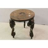 Indian Carved Hardwood Circular Table raised on Three Legs carved in the form of Elephant Heads,