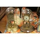 Two vintage glass domed clocks