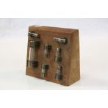 Mahogany backed display of vintage Fuses, stand approx 17 x 14.5 x 5.5cm at the widest points