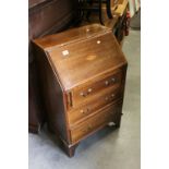 Edwardian Mahogany Inlaid Bureau, the drop front opening to reveal a fitted interior over three long